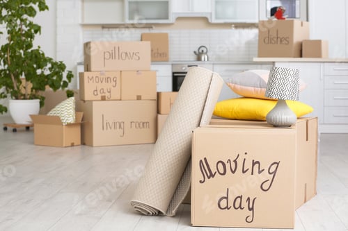 Preview: Moving boxes and household stuff in kitchen. Space for text