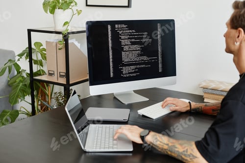 Preview: Computer programmer working with software