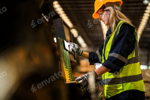 Preview: woman worker carpenter checking the quality of wooden products a