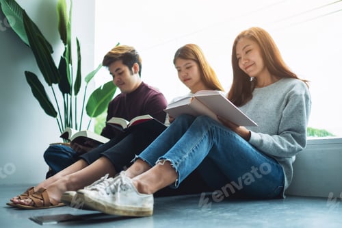 Preview: Group of young people sitting and enjoyed reading books together