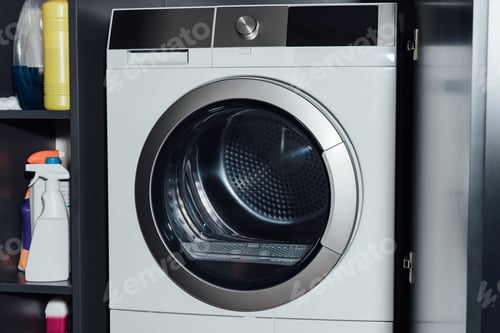 Preview: modern and white washing machine at home