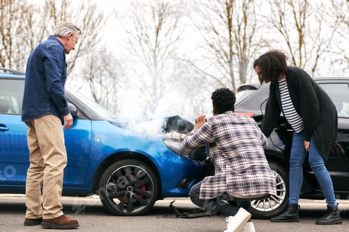 Preview: Young Couple Take Photos On Mobile Phone Of Damage To Car In Accident With Senior Driver