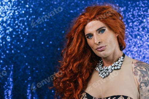 Preview: Gay man dressed like drag queen with blue bright background