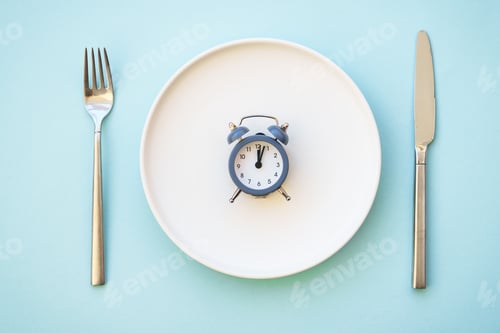 Preview: Intermittent fasting concept. Top view on blue.