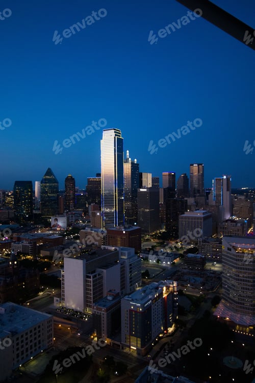 Preview: Vertical shot of modern skyscrapers at sunset in Downtown Dallas, Texas