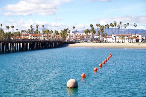 Preview: Looking a pier and downtown Santa Barbara over ocean on beautiful day