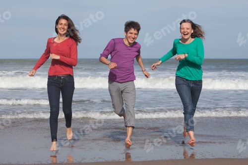 Preview: Three Friends Running on a Beach
