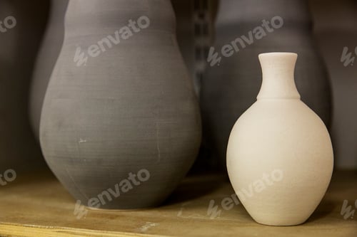 Preview: Close up of clay pots in the drying process, pre-firing. Hand thrown pottery.