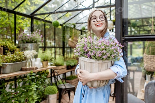 Preview: Woman with lavender in the greenhouse