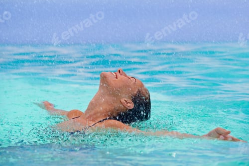 Preview: Soothing relaxation in the waters...Close up of a young woman enjoying a swim.