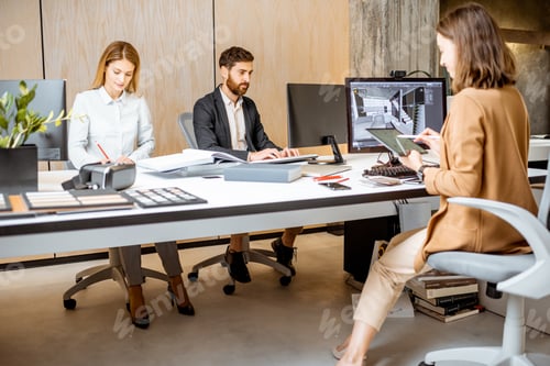 Preview: Designers working on the computers in the office