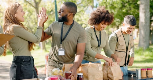 Preview: High five, team and food for charity and nonprofit, package and meal for homeless in park. Kindness