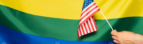 Preview: cropped view of man holding american flag against lgbt colorful background, banner