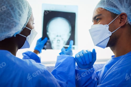 Preview: Medical Professionals Reviewing an X-Ray in a Hospital