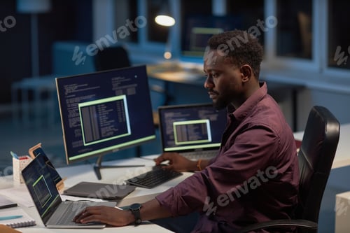 Preview: Serious developer working with computer program