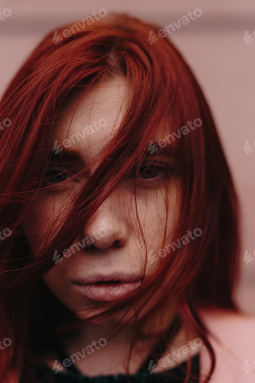 Preview: Beautiful And Stylish Girl With Red Hair Walks In The City And Her Hair Is In The Wind
