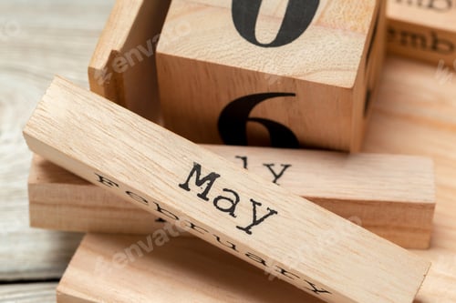 Preview: top view of parts of wooden calendar on dark wooden tabletop
