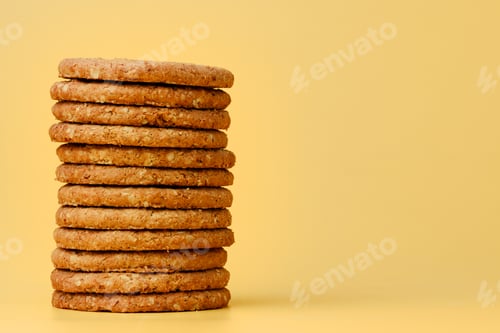 Preview: Stack of round oat cookies on paper background
