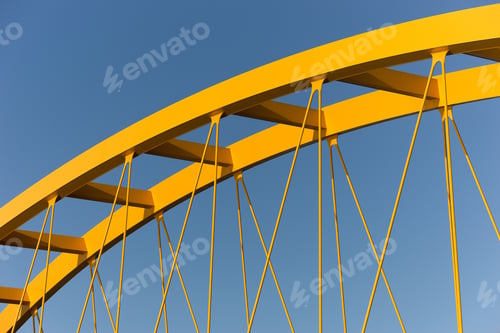 Preview: Yellow cable-stayed bridge with a clear blue sky in the background