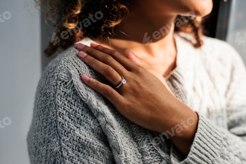 Preview: Cheerful woman with engagement ring