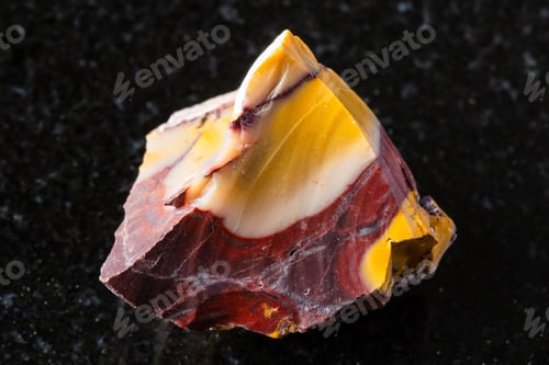 Preview: sample of raw colorful mookaite rock on black