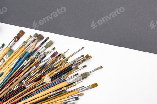 Preview: Many brushes for painting on a colored background, top view.