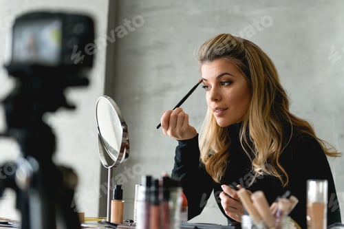Preview: Putting make up in front of camera