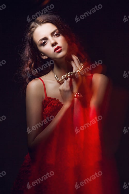 Preview: Blurred color art portrait of a girl on a dark background. Fashion woman with beautiful makeup and a