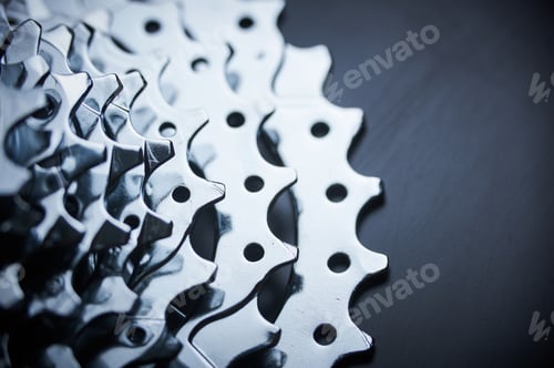 Vista previa: New empty rear mountain bike cassette on the black background close up