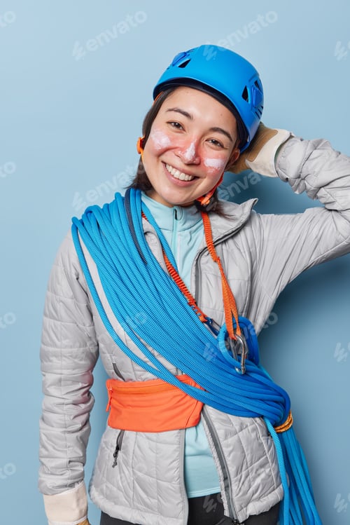 Preview: Trekking adventure girl wears gear for accident prevention prepares for canyoning applies facial