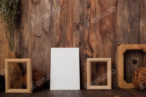 Preview: mockup blank white paper poster card with wood photo frame and wicker ball on table