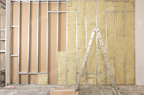 Preview: Ladder near wall with metal studs and insulation material indoors