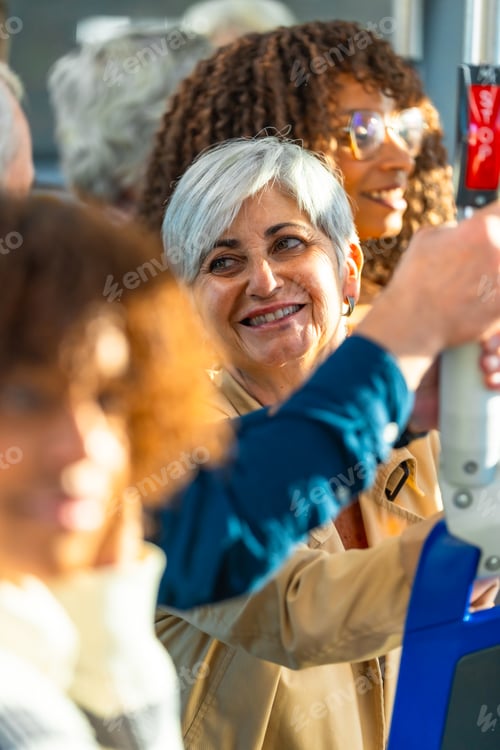 Preview: Senior woman smiling on public transport bus