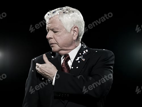 Preview: Man in Dark Suit Covered with Confetti