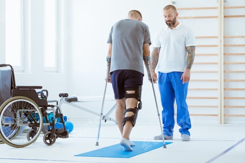 Preview: Injured patient learns to walk on crutches in medical office