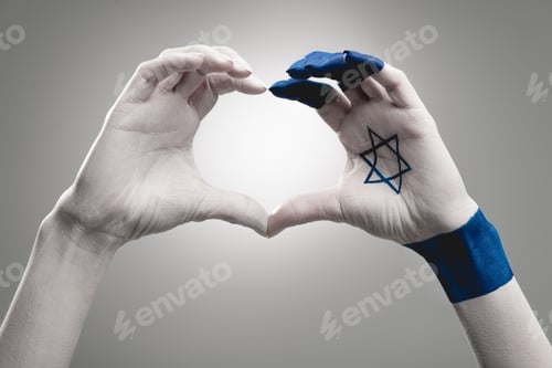 Preview: cropped view of female hands with star of david showing heart on grey