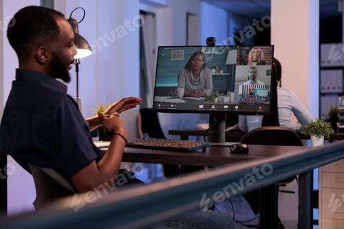 Preview: Executive manager meeting with team of people on online videocall