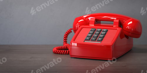 Preview: Red telephone on a wooden table.