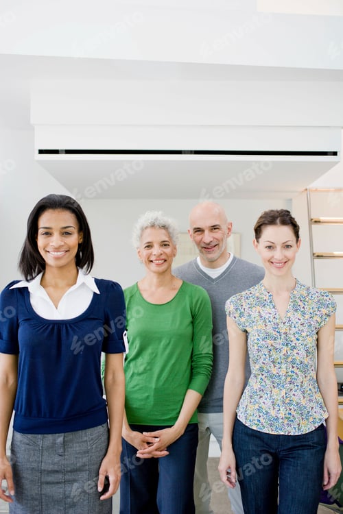 Preview: 4 business people looking at viewer