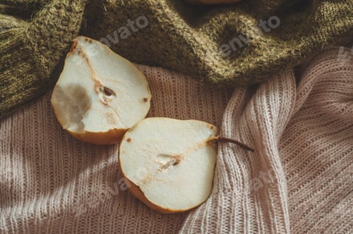 Preview: Autumn nature concept. Fall pears on knitted sweaters. Thanksgiving dinner