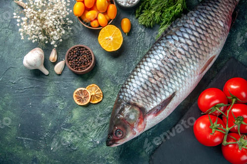 Preview: top view fresh raw fish with tomatoes and greens on dark background food health water fish color