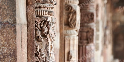 Preview: Stone columns with decorative bas relief of Qutb complex in South Delhi, India, close up pillars