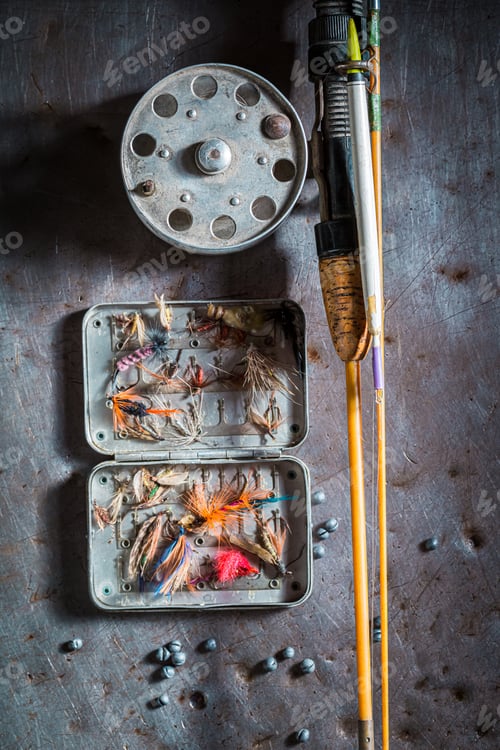 Preview: Retro fishing equipment with rod and lures. Fishing equipment.