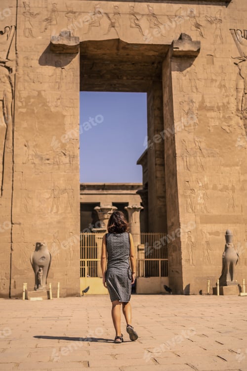 Preview: A young tourist at the entrance to the Edfu Temple near the Nile River in Aswan