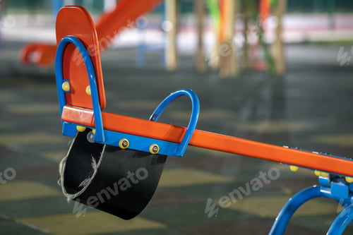 Preview: Seesaw swing in preschool yard with soft rubber flooring at night