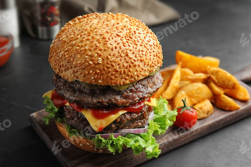 Preview: Delicious burger with meat cutlets on black table, closeup