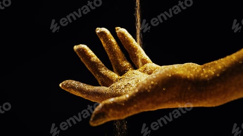 Preview: Luxury and beauty. Magic of golden glitter hands orchestrating sands of time.