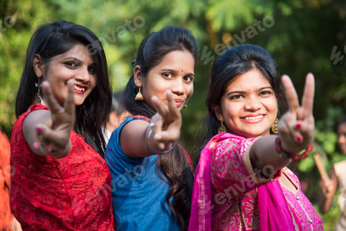 Preview: Happy Indian young girls smiling and having fun at outdoor.
