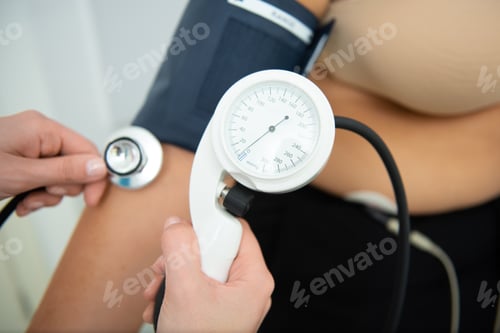 Preview: Woman undergoing a comprehensive cardiology exam in a bright clinical setting