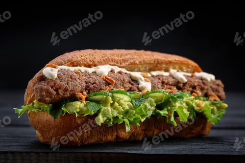Preview: close up of kebab sandwich on black wooden background